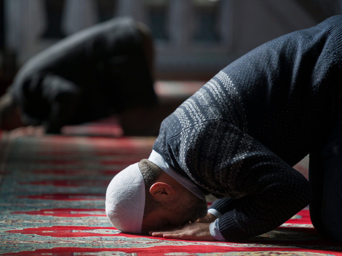 A worshipper falls into prosration in a Mosque
